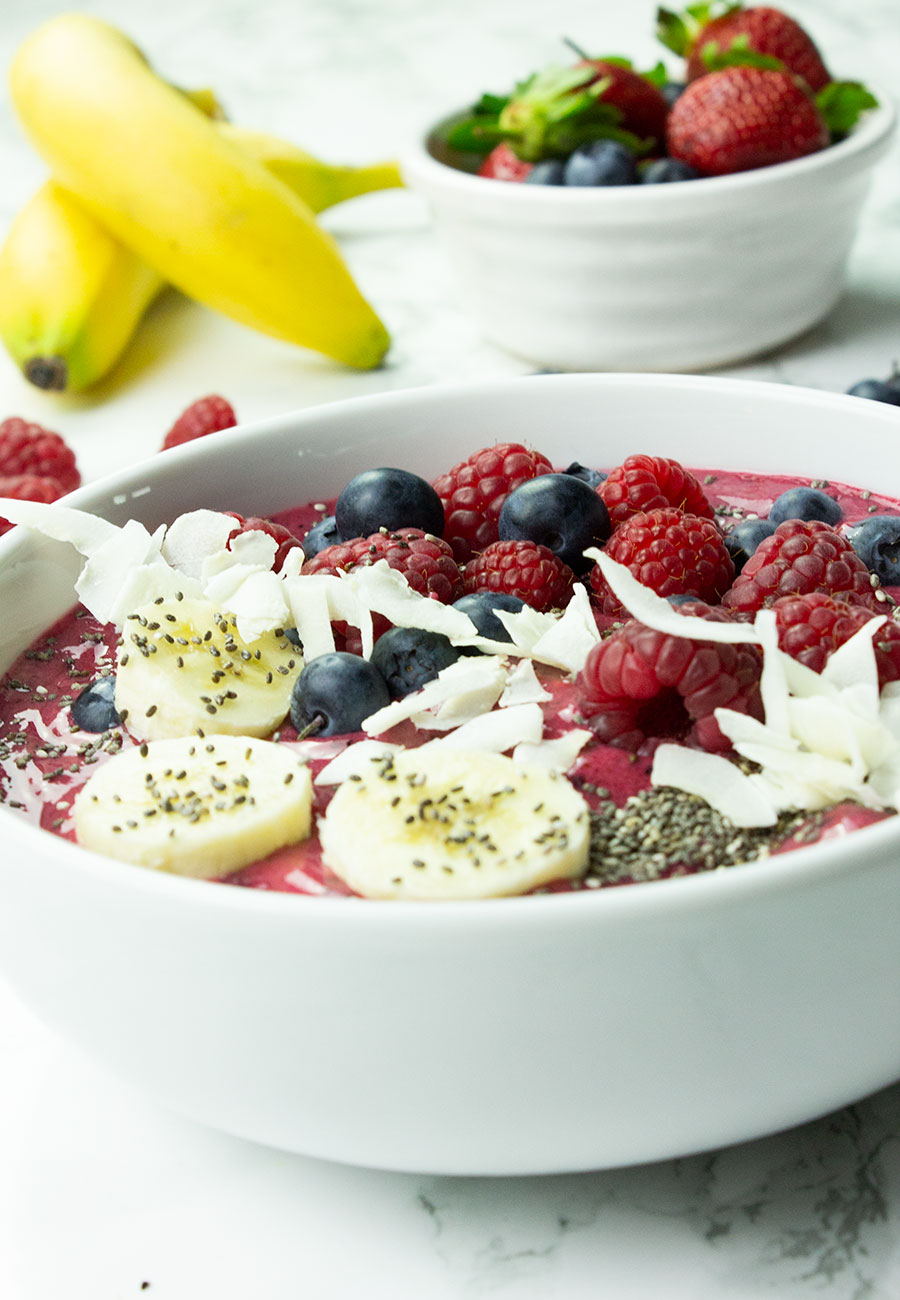 Smoothie bowl with banana, raspberries and blueberries 