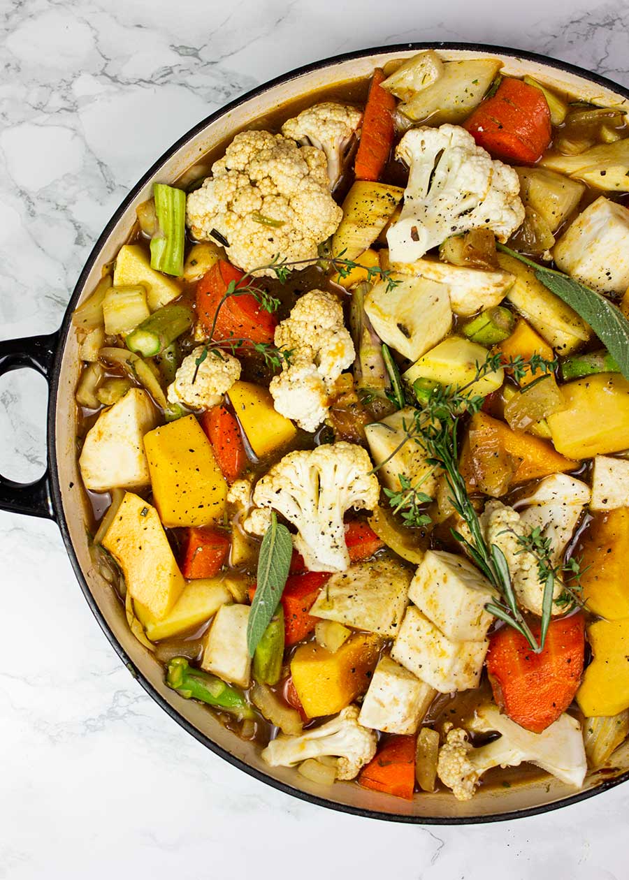 Warming vegetable stew with herby dumplings